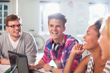 Friends talking at desk Stock Photo - Premium Royalty-Free, Code: 6113-06626005