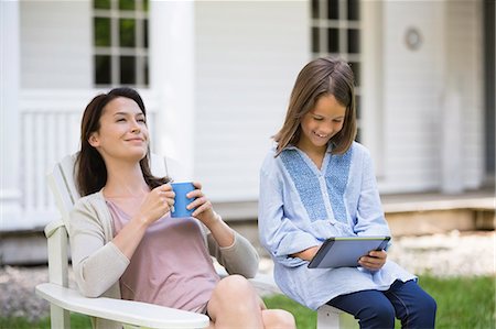 family yard - Mother and daughter relaxing outdoors Stock Photo - Premium Royalty-Free, Code: 6113-06626348