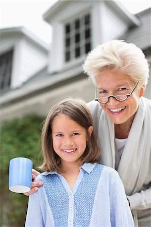 simsearch:649-03858052,k - Woman and granddaughter smiling together outdoors Stock Photo - Premium Royalty-Free, Code: 6113-06626394