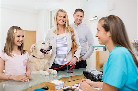 dog leash girl - Owners bringing dog to vet's surgery Stock Photo - Premium Royalty-Free, Code: 6113-06626480