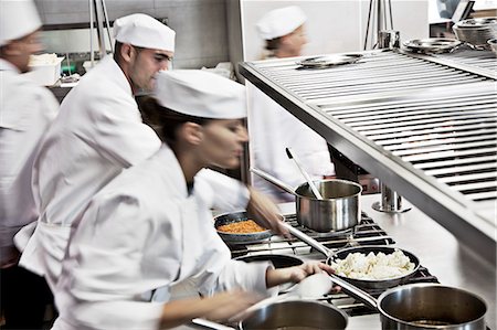 Chefs cooking in restaurant kitchen Stock Photo - Premium Royalty-Free, Code: 6113-06626552