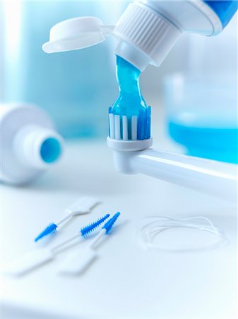 dental floss - Close up of toothpaste squeezing on electric toothbrush Stock Photo - Premium Royalty-Free, Code: 6113-06626653