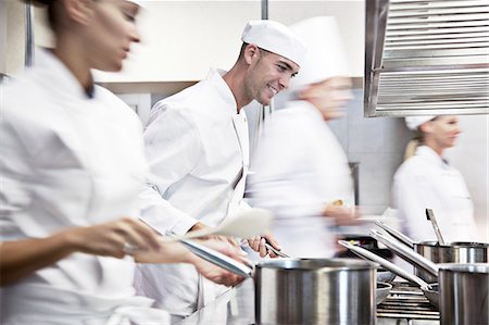 Chefs cooking in restaurant kitchen Stock Photo - Premium Royalty-Free, Code: 6113-06626607