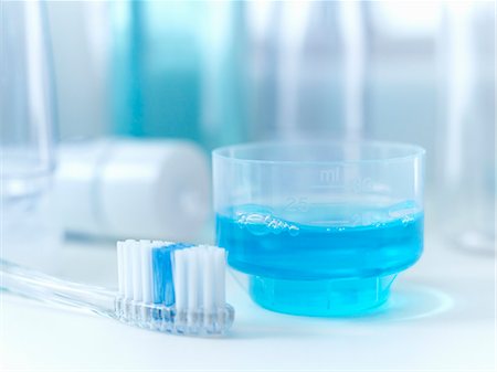 Close up of toothbrush and mouthwash Stock Photo - Premium Royalty-Free, Code: 6113-06626631