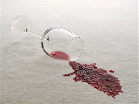 ruined food - Glass of red wine spilled on white carpet Stock Photo - Premium Royalty-Free, Code: 6113-06626731