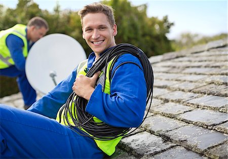 satelite - Workers installing satellite dish on roof Stock Photo - Premium Royalty-Free, Code: 6113-06753241