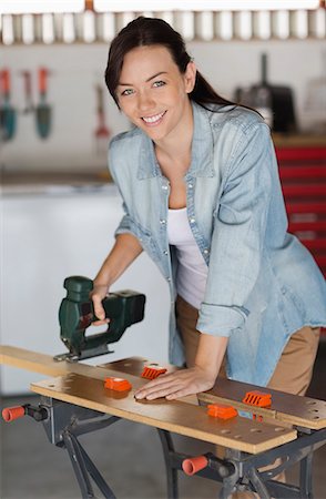 Woman working in workshop Foto de stock - Sin royalties Premium, Código: 6113-06753296