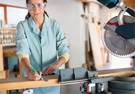 Woman working in workshop Stock Photo - Premium Royalty-Free, Code: 6113-06753353