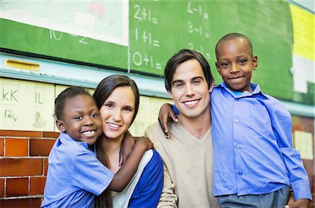 female teacher portrait students - Teachers and students smiling in class Stock Photo - Premium Royalty-Free, Code: 6113-06753852