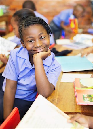 Student smiling in class Stock Photo - Premium Royalty-Free, Code: 6113-06753870