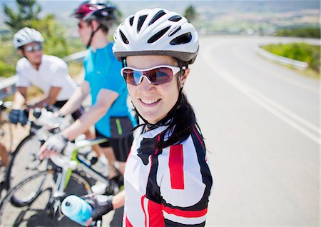 Cyclist smiling before race Stock Photo - Premium Royalty-Free, Code: 6113-06753992