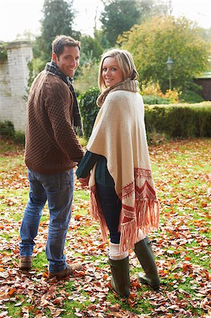 poncho - Couple holding hands outdoors Stock Photo - Premium Royalty-Free, Code: 6113-06720233