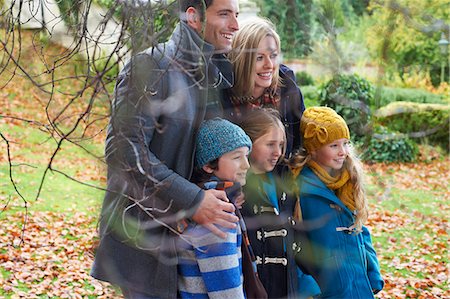 simsearch:6113-06720252,k - Family smiling together outdoors Stock Photo - Premium Royalty-Free, Code: 6113-06720314