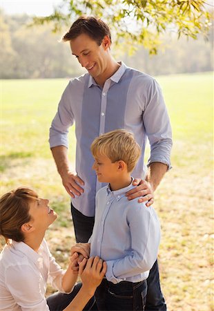 simsearch:6113-06498556,k - Family relaxing together in park Stock Photo - Premium Royalty-Free, Code: 6113-06720484