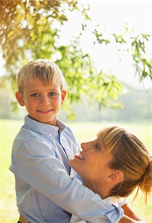 Mother and son hugging in park Stock Photo - Premium Royalty-Free, Code: 6113-06720493