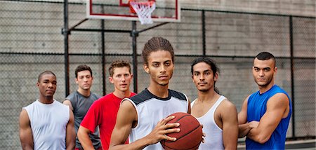 Men standing on basketball court Stock Photo - Premium Royalty-Free, Code: 6113-06720412