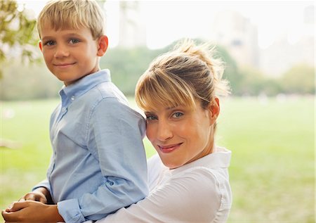 Mother and son relaxing in urban park Stock Photo - Premium Royalty-Free, Code: 6113-06720422