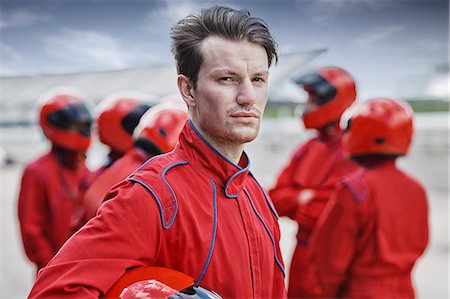 racer - Racer holding helmet on track Stock Photo - Premium Royalty-Free, Code: 6113-06720746