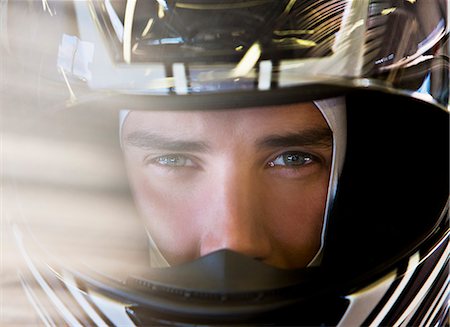 driver (vehicle, male) - Close up of racer wearing helmet Stock Photo - Premium Royalty-Free, Code: 6113-06720731