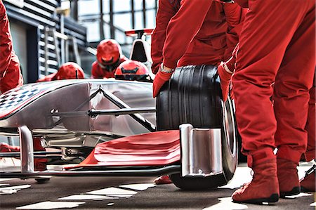 Racing team working at pit stop Stock Photo - Premium Royalty-Free, Code: 6113-06720820