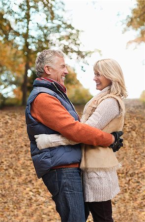 simsearch:6113-07242393,k - Older couple hugging in park Stock Photo - Premium Royalty-Free, Code: 6113-06721257
