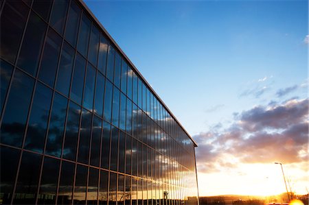 sunsets not scenic not people - Sunrise sky reflected in modern building windows Stock Photo - Premium Royalty-Free, Code: 6113-06721374