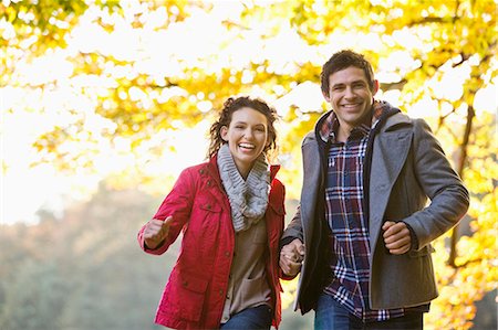 running in the fall - Couple walking in park Stock Photo - Premium Royalty-Free, Code: 6113-06721305