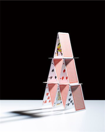 pyramid of playing cards - House of cards Stock Photo - Premium Royalty-Free, Code: 6113-06898972