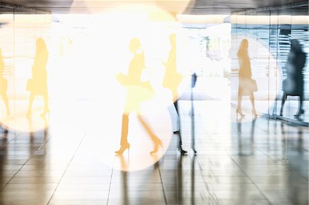 Business people walking in lobby Stock Photo - Premium Royalty-Free, Code: 6113-06899078