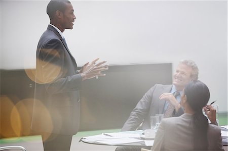 Gesturing businessman leading meeting in conference room Stock Photo - Premium Royalty-Free, Code: 6113-06899168