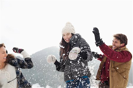 snow ball - Couple enjoying snowball fight Stock Photo - Premium Royalty-Free, Code: 6113-06899342