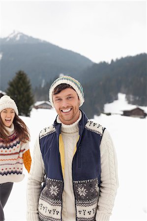 simsearch:6113-06899345,k - Portrait of happy couple in snowy field Stock Photo - Premium Royalty-Free, Code: 6113-06899377