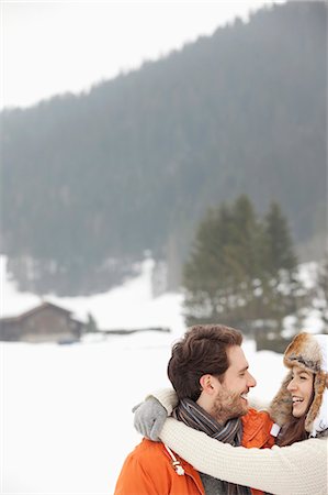 simsearch:6113-07790711,k - Happy couple hugging in snowy field Photographie de stock - Premium Libres de Droits, Code: 6113-06899378