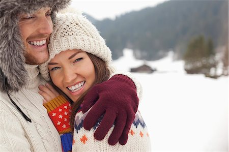 simsearch:6113-06899345,k - Close up portrait of happy couple hugging in snowy field Stock Photo - Premium Royalty-Free, Code: 6113-06899387