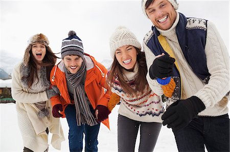 Portrait of enthusiastic friends in snow Stock Photo - Premium Royalty-Free, Code: 6113-06899317