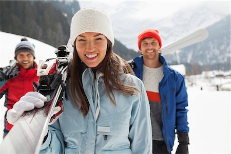 simsearch:6113-06899345,k - Portrait of smiling friends carrying skis Stock Photo - Premium Royalty-Free, Code: 6113-06899320