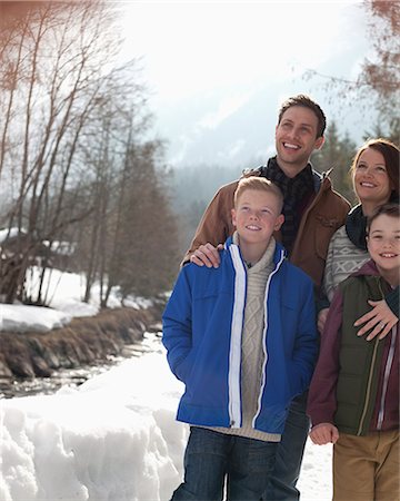 simsearch:6113-06899473,k - Happy family standing in snow Stock Photo - Premium Royalty-Free, Code: 6113-06899442