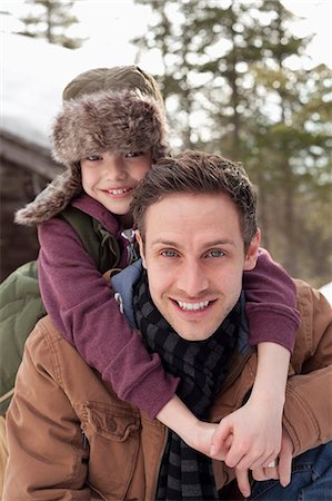 simsearch:6113-06899473,k - Close up portrait of happy father piggybacking son Stock Photo - Premium Royalty-Free, Code: 6113-06899473
