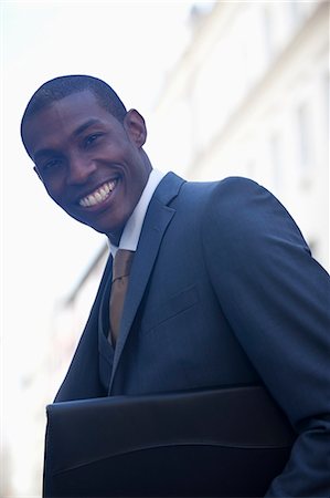portfolio - Portrait of smiling businessman Stock Photo - Premium Royalty-Free, Code: 6113-06899683