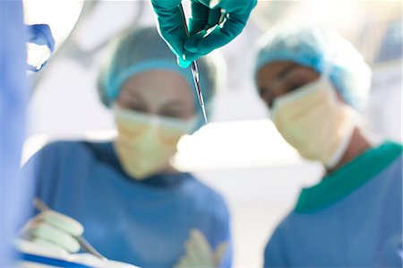 Surgeons working in operating room Stock Photo - Premium Royalty-Free, Code: 6113-06908297