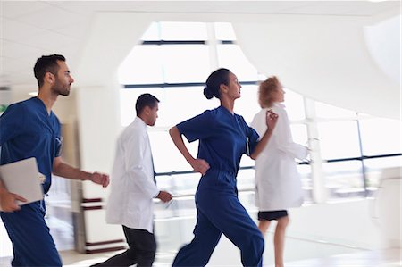 emergency room people - Hospital staff running down hallway Stock Photo - Premium Royalty-Free, Code: 6113-06908201