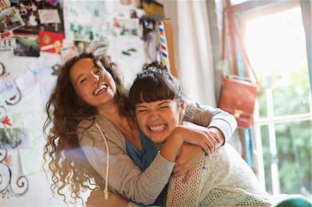 Women playing together indoors Stock Photo - Premium Royalty-Free, Code: 6113-06908493