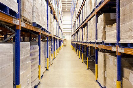 storage (industrial and commercial) - Stacks of boxes in aisle in warehouse Stock Photo - Premium Royalty-Free, Code: 6113-06908422