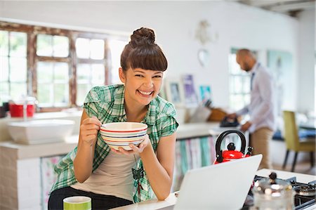 spouse - Woman using laptop at breakfast Stock Photo - Premium Royalty-Free, Code: 6113-06908594