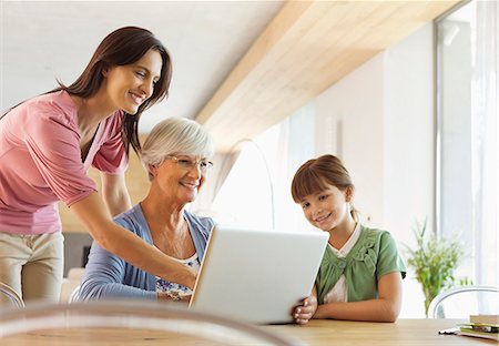 family in a table - Three generations of women using tablet computer Stock Photo - Premium Royalty-Free, Code: 6113-06908753