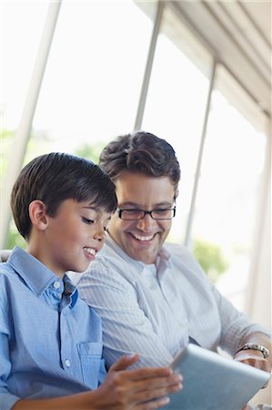 simsearch:6113-06908842,k - Father and son using tablet computer Stock Photo - Premium Royalty-Free, Code: 6113-06908774