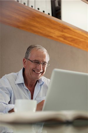 senior coffee alone - Businessman working at desk Stock Photo - Premium Royalty-Free, Code: 6113-06908714