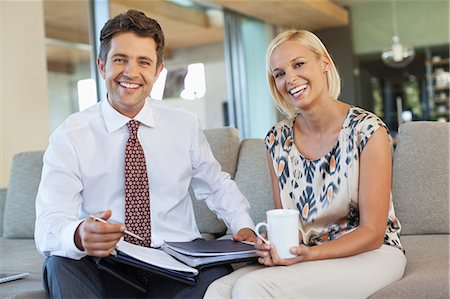 Business people talking on sofa Stock Photo - Premium Royalty-Free, Code: 6113-06908721