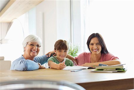 Three generations of women doing homework Stock Photo - Premium Royalty-Free, Code: 6113-06908848