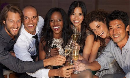 simsearch:6113-06909171,k - Friends toasting each other at party Stock Photo - Premium Royalty-Free, Code: 6113-06909096